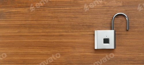 Preview: Modern padlock on wooden table, top view. Space for text