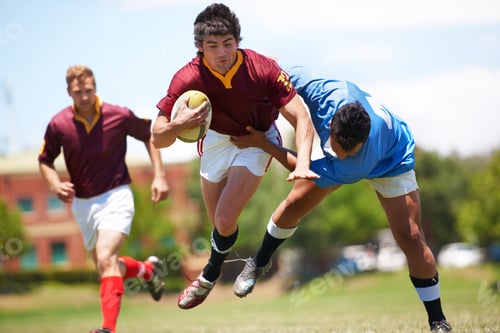 Preview: Almost there...Full length shot of a young rugby player trying to avoid a tackle.