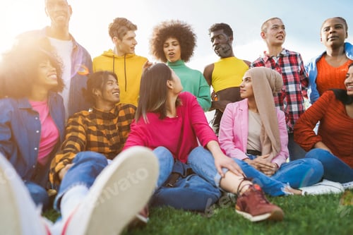 Preview: Young diverse people having fun outdoor laughing together - Soft focus on girl with green shirt