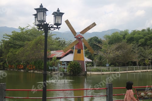 Preview: Scenic Park View with Windmill and Greenery