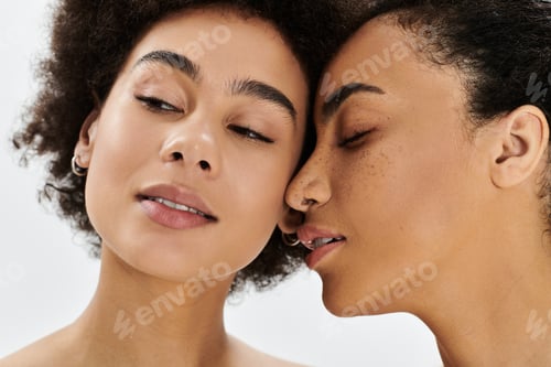 Preview: Two women in an artistic portrait sharing an intimate moment, showcasing connection and beauty