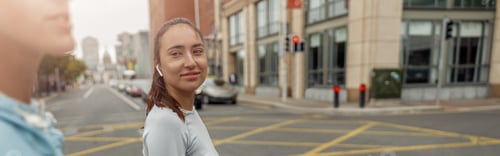 Preview: Two sportive young female friends walking city after morning running