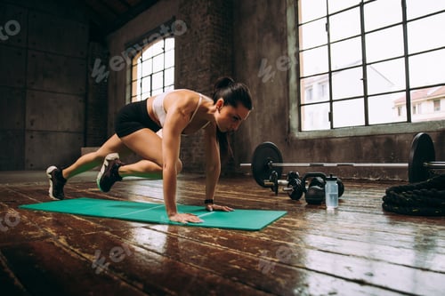 Preview: female bodybuilder training at the gym