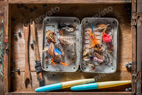 Preview: Vintage fishing tackle with flies and rods. Fishing equipment.