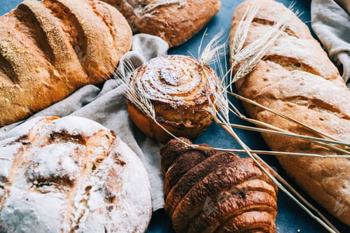 Preview: Different types of fresh bread and bakery on the table.