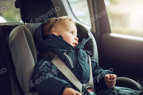 Preview: I wonder where were heading off to...Cropped shot of an adorable little boy sitting in a car seat.
