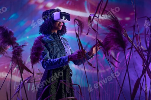 Preview: Metaverse digital cyber world technology, woman with virtual reality VR goggles playing augmented
