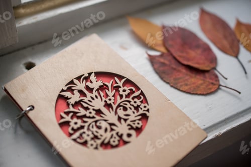 Preview: Autumn leaves and notebook