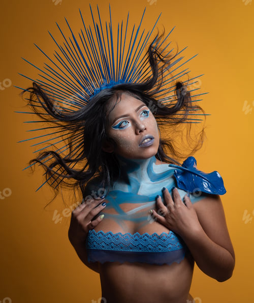 Preview: Muse body painting in yellow background