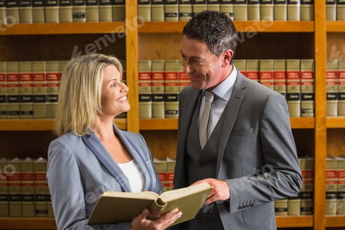 Preview: Lawyers Reading Book In The Law Library At The University