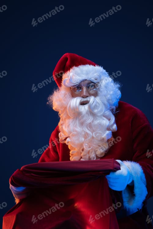 Preview: Santa with big bag and glasses looking at camera