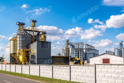 Preview: Modern Granary elevator. Silver silos on agro-processing and manufacturing plant