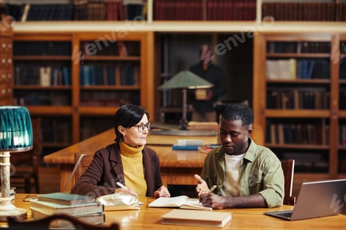 Preview: Two Students in Library