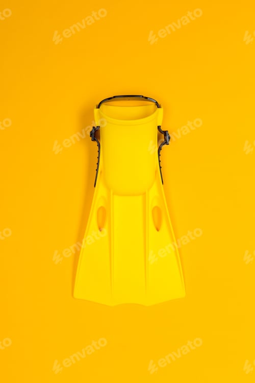 Preview: Bright yellow snorkeling fin against a vibrant yellow background for underwater adventures