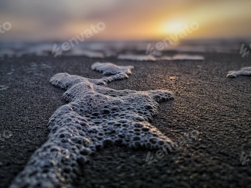 Preview: Closeup shot of bubbles from a seawater in the seashore
