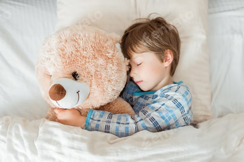 Preview: Kid on sleeping bed, happy bedtime in white bedroom
