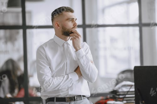 Preview: Businessman sitting on the table.