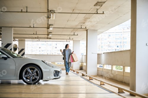 Preview: Pretty positive female going to her car
