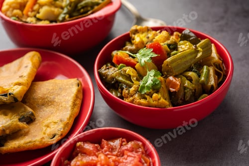 Preview: Bengali Bhog food for Indian Hindu Durga Puja or pooja festival. Khichadi, labra, tomato chutney