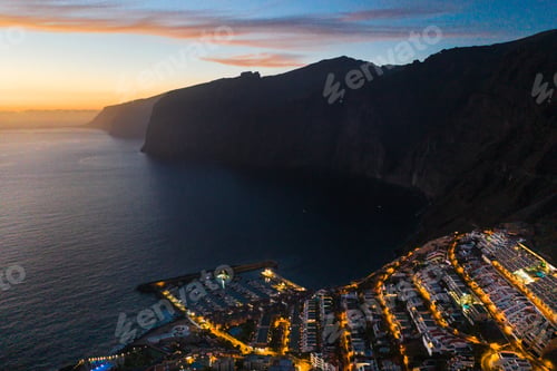 Preview: Top view of the houses located on the rock of Los Gigantes at sunset, Tenerife, Canary Islands
