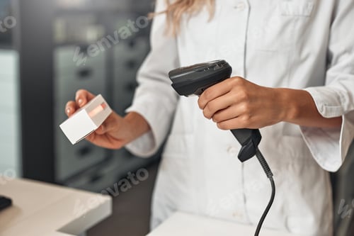 Preview: Scanning barcode on a medicine package at pharmacy counter