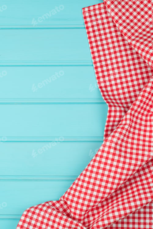 Vista previa: White and red towel over wooden table