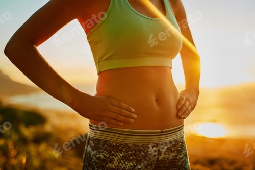 Preview: Shot of an unrecognizable young woman standing with her hands on her hips outside
