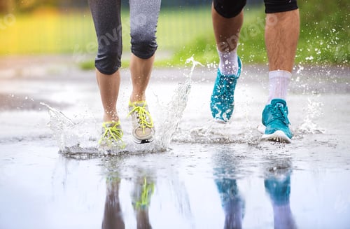 Preview: Couple running in rainy weather