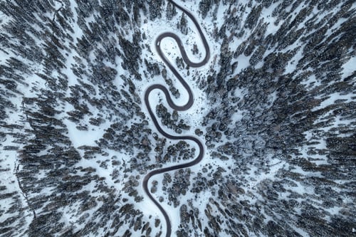 Preview: White car on a funny mountain road