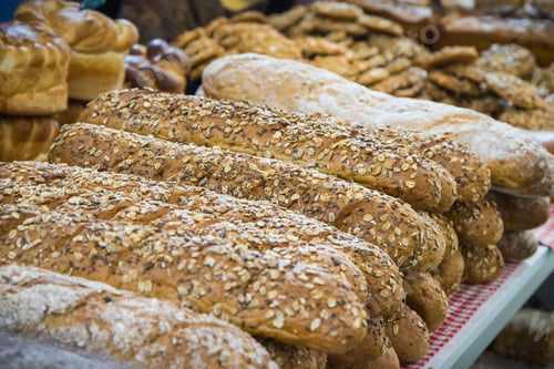 Preview: Freshly baked wholegrain baguette with grains in bakery