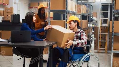 Preview: Man in wheelchair working in storage room with goods