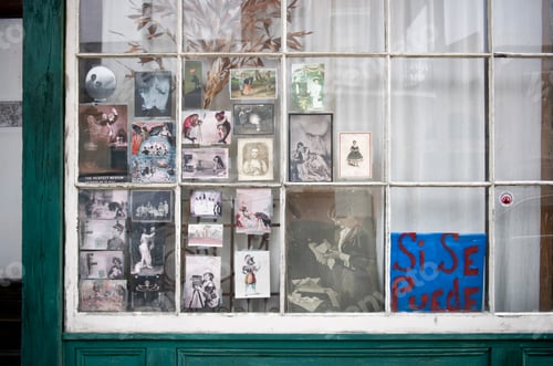 Preview: Vintage photographs in window in New Orleans, Louisiana