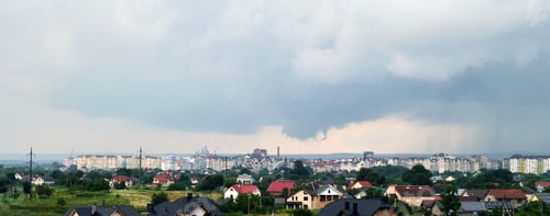Preview: Landscape of dark clouds forming on stormy sky during thunderstorm over city rural area.