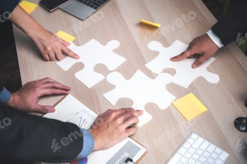 Preview: Group of business people assembling jigsaw puzzle and represent team support and help concept