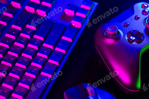 Preview: Computer keyboard, mouse and joystick on black background