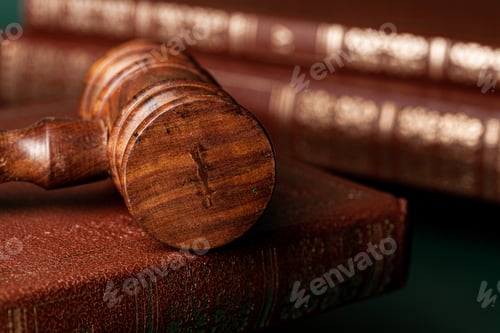 Preview: Close up of a brown wooden gavel and book
