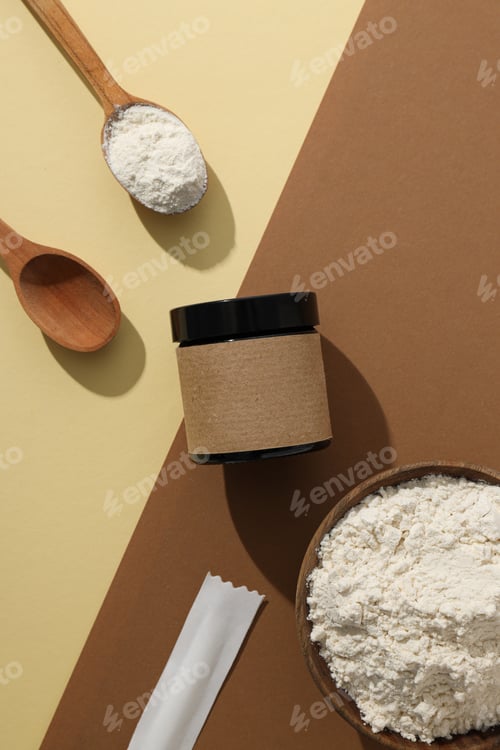 Preview: Collagen powder in a wooden spoon with a brown bottle