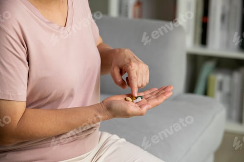 Preview: Senior woman taking medicine