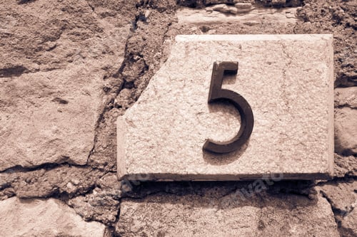 Preview: The Figure Five Is Placed By A Closeup On A Stone Wall For The Indication Of House Number