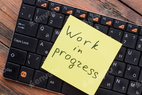Preview: Close-up of work in progress sticky note message on keyboard.