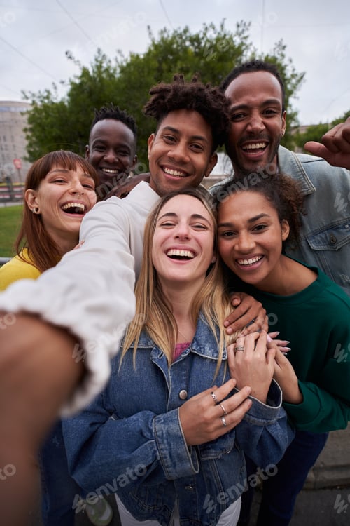 Preview: Vertical photo of Cheerful of friends taking smiling selfie. Group young people having fun outdoors