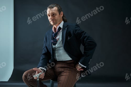 Preview: Businessman Sitting On An Armchair