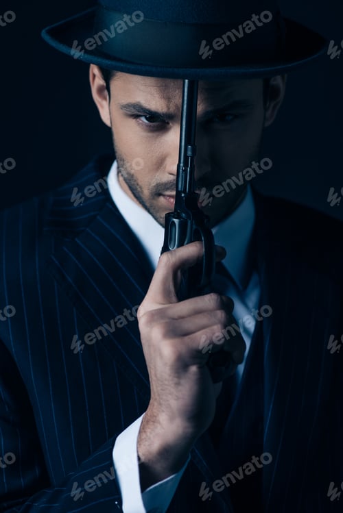 Preview: Gangster holding gun in front of face on dark blue