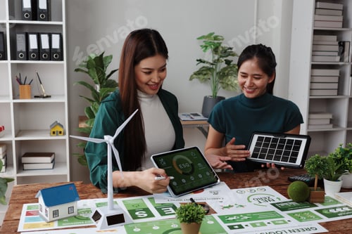 Preview: Engineers discussing esg project showing solar panel and wind turbine