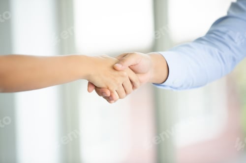 Preview: business team touching hands together after complete a deal in meeting.