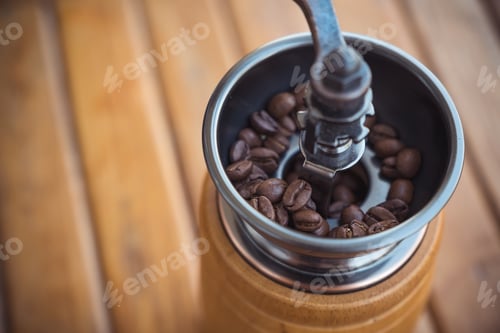 Preview: Closeup image of a vintage wooden coffee grinder
