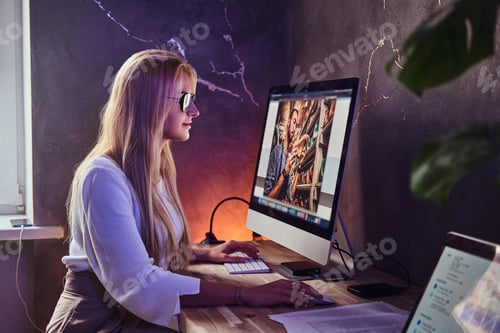 Preview: Pretty woman is working at her office