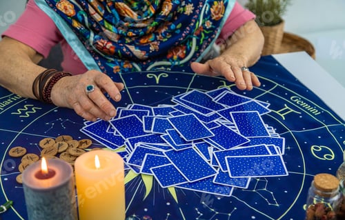 Preview: Fortune teller reads tarot cards. selective focus.