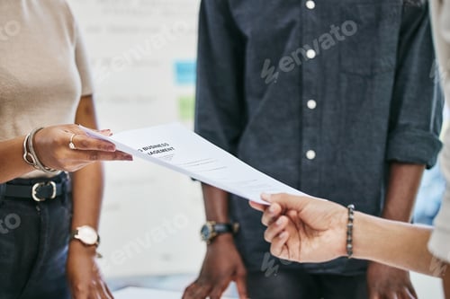 Preview: Please sign on the dotted line. Shot of businesspeople transferring documents.