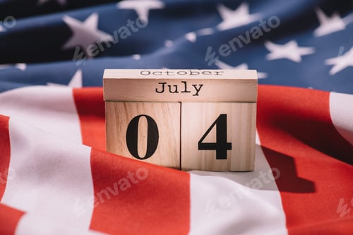 Preview: close up view of wooden calendar with 4th july date on american flag, americas independence day